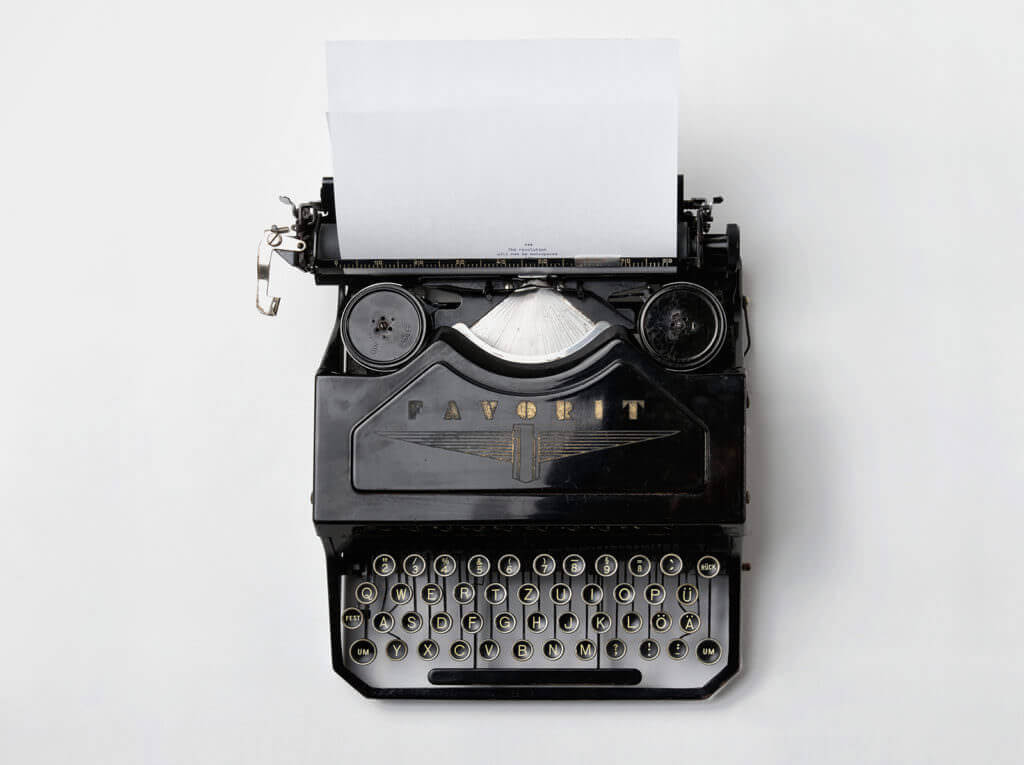 a typewriter with a paper in it